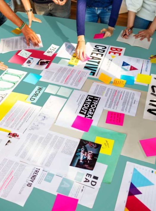 paper on the table with hands